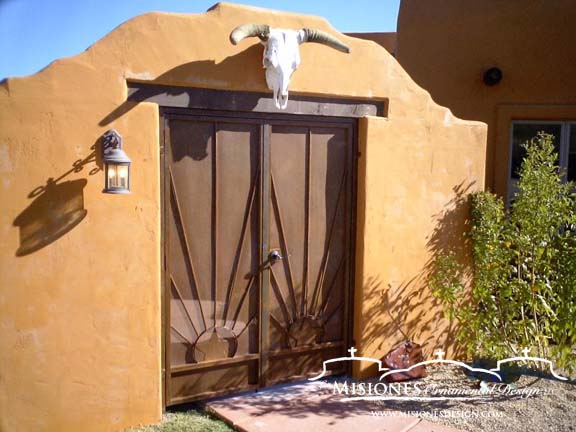 rust colored southwest design with two suns, double door, steel metal courtyard gate