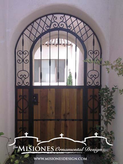 black and wood arched wood steel metal courtyard gate