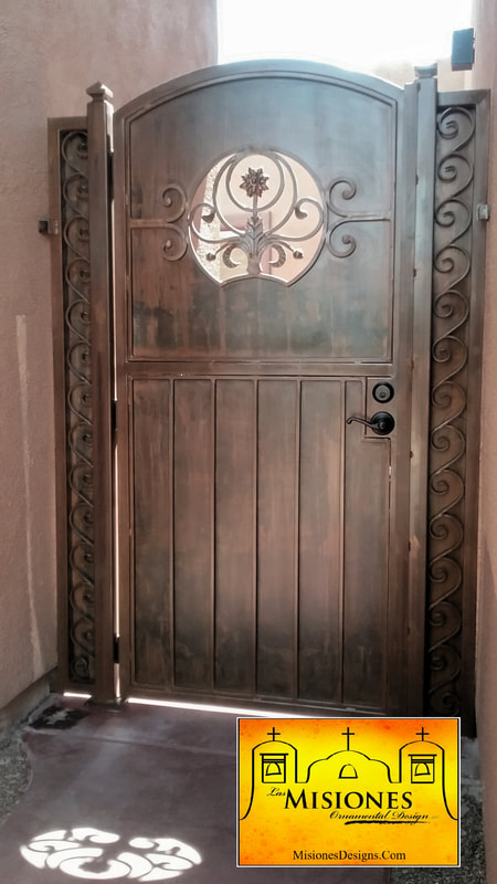 dark rust colored, solid single door, bar designs on bottom, viewport with scrolls, side panels with wave scrolls, steel metal courtyard gate