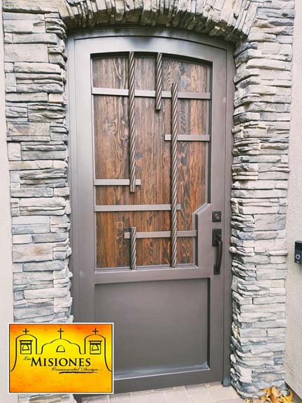 single door courtyard gate with solid wood paneling set in a modern steel frame with straight line details