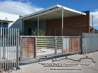 Nogales Community Development driveway gate, rust and silver