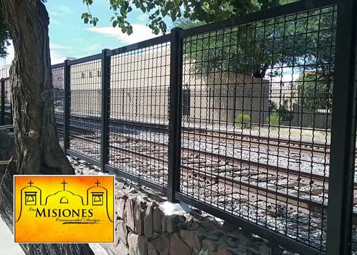 nogales az city railroad and park fencing, black lattice paneling set into rock base