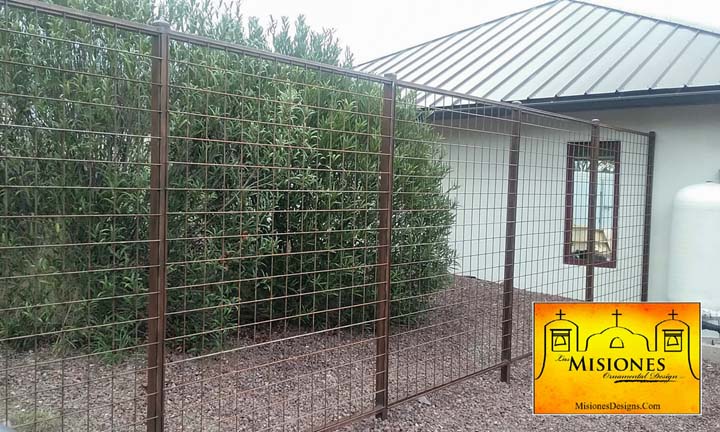 property fencing with lattice paneling, tall and rust colored