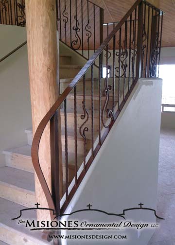 indoor railing, staircase, balusters are vertical and some are freeform wavy curls