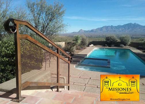 outdoor handrail for large stone steps by pool, screen paneling instead of balusters