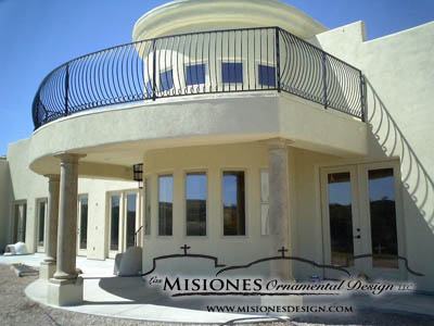 outdoor railing for second floor patio, black paneling, balusters are vertical and curved facing outward