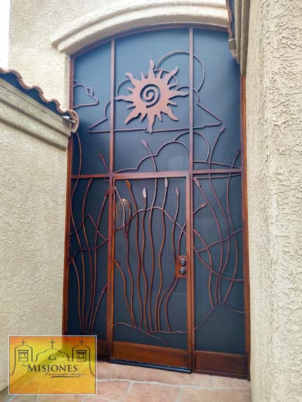 single door enclosure screen with a desert scene in a large frame paneling for a new entryway