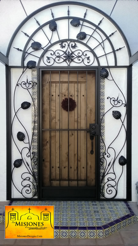 screen door, black with kickplate, trellis with vine and ivy design surrounding the sides, arbor above pathway to door