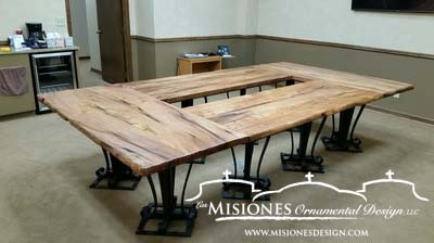 conference table, eight ornamental table legs with four mesquite tops forming a large rectangle with small opening in center