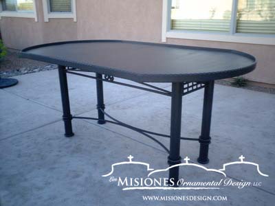 black metal table with four round legs, black metal top, raised edges to hold glass, wood, or anything